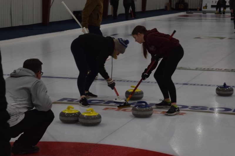 The Canora Christmas Bonspiel was held on December 26 to 28 at the Sylvia Fedoruk Centre, and was once again an opportunity for family and friends to spend quality time together during the holiday season. Skip Terry Wilson made the call as his daughters Abby (left) and Lila swept hard to keep this rock on line. / Rocky Neufeld