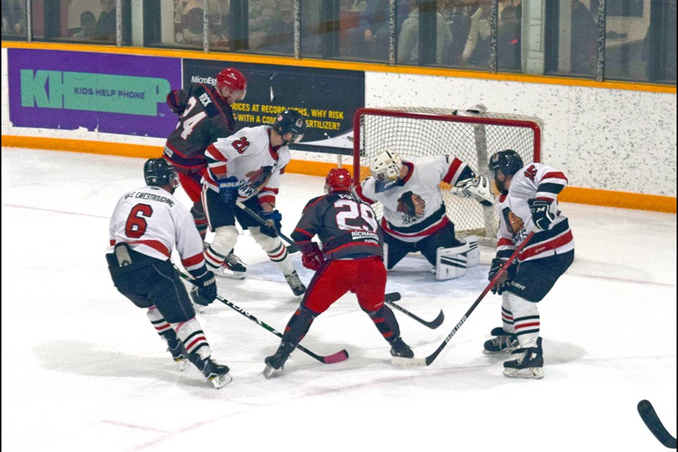 The Canora Cobras (dark jerseys) put plenty of pressure on the visiting Wapella Hawks on Dec. 2, and skated to a 7-3 win.