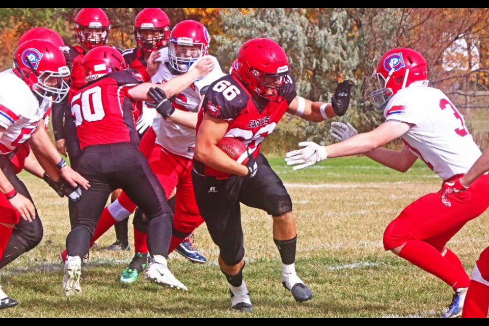 WCS Eagles player Owen Istace had his hand out to help him power through for more yards during their game vs the Swift Current Colts on Saturday; Istace had 139 yards in rushing altogether.