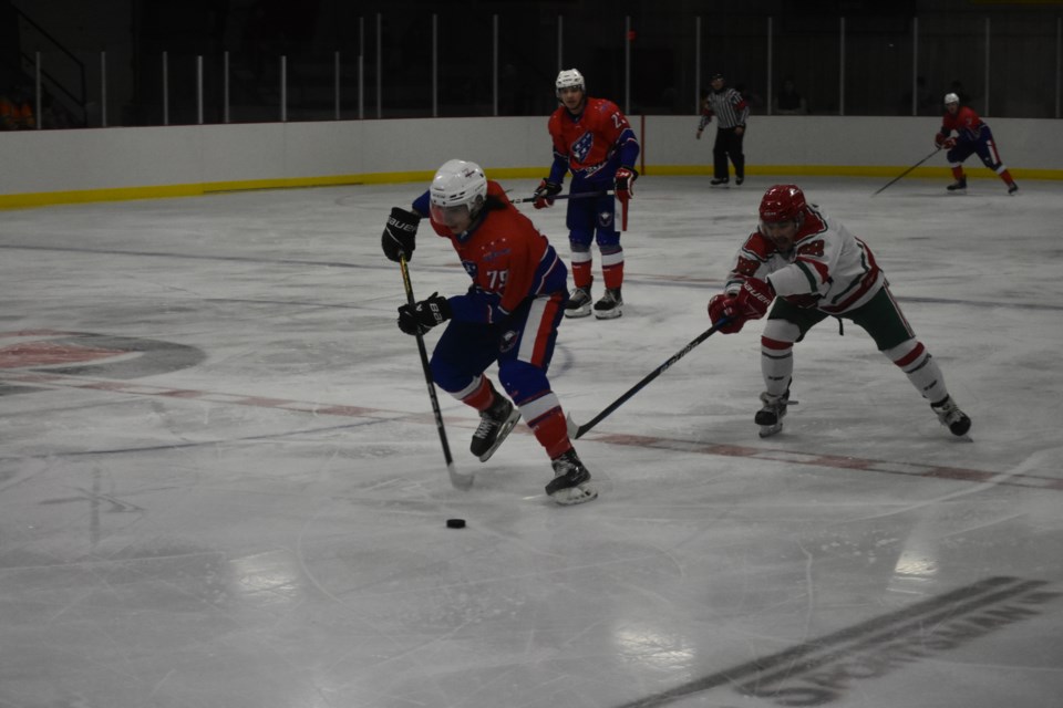 Kailum Gervais, left, a player who likely grew fear in the hearts of the Cobras, would carry the puck as quickly as he could, dodging Cobra advances, as he made his way toward their goal.