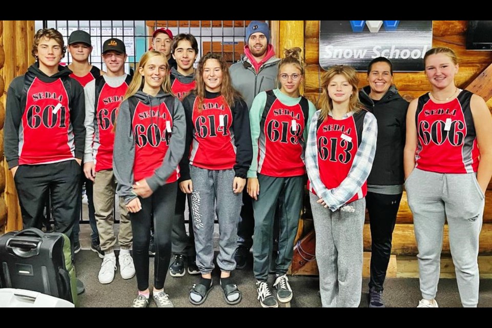 The cross-country athletes who took part in the provincial championship gathered following the competition on Saturday, In the back from left are Mason Sidloski and Calder McMillan. In the middle row are Camden Husband, Nash Hignett, Emerson Jack and coach Branden Smith. In front are Jyllian Payak, Anna Tronson, Autumn Vilcu, Willow Davis, coach Kristy Gall and Olivia Pederson.