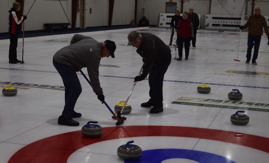 For the first time since March 2020, curlers in Canora have the opportunity to get back on the ice. On November 18, Darryl Stevenson, left, and Brian Herriges swept hard to keep a rock on line during the first afternoon drop-in curling of the new season. In keeping with the Government of Saskatchewan Public Health Order, Canora curlers “on the cold side of the glass” are not required to wear a mask because a proof of vaccination policy is in place for the facility. For more information, visit canora.com. / Rocky Neufeld