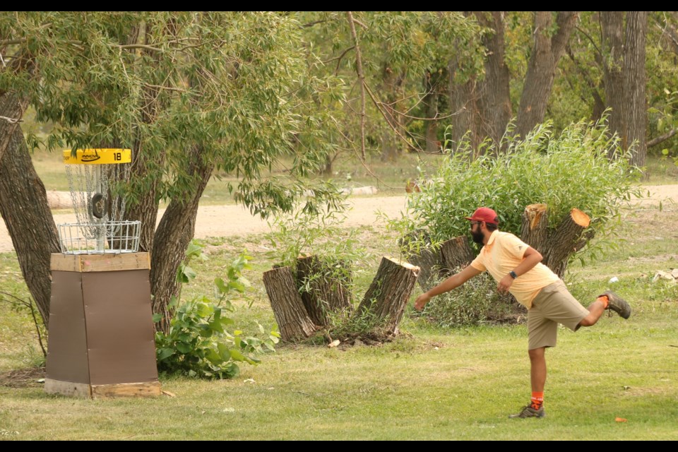 Chase Samuel of Saskatoon putts out on #18 in Melville at the Sask Open Aug. 15.