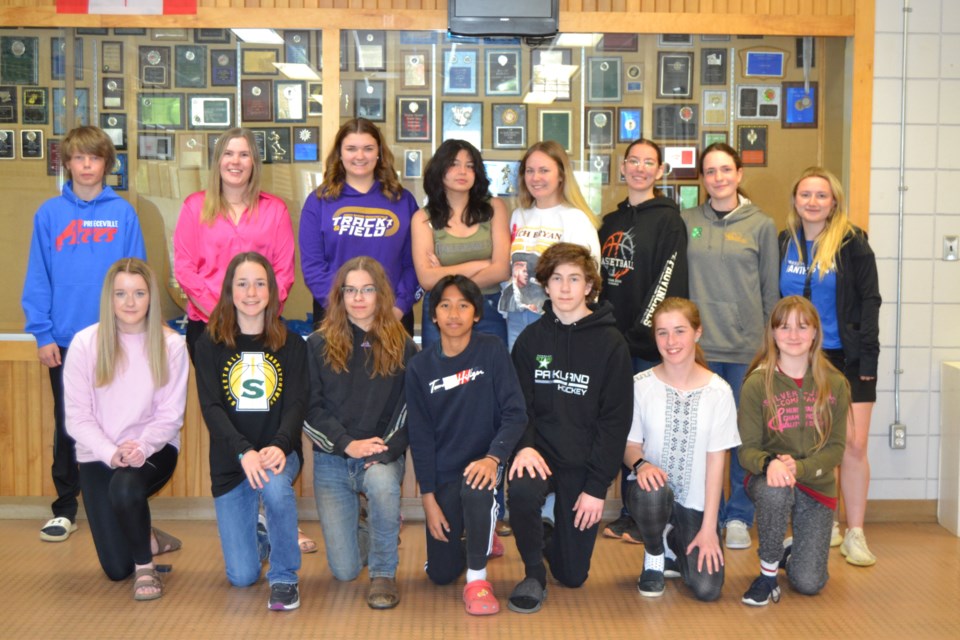 Members of the Preeceville School Track and Field team from left, were: (back row) Carter Moekerk,  Paige Nowakoski, coach, Sarah Masko, Kiya Tucker, Myrandah Gagnon, Maggie Bartel, Amber Spray and Madison Stoll, coach and (front) Asia Kilborn, Hailey Spray, Savannah Nielson, Wayne Regudo, Gavin Erickson, Melissas Durand and Kiarah Federuik.