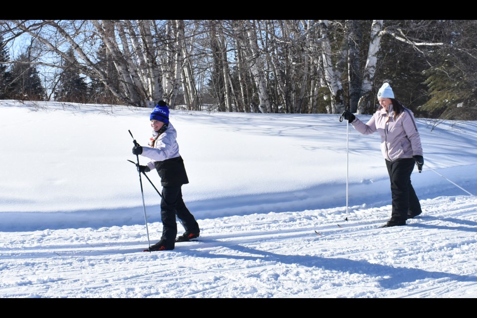 Skiers at the loppet, Paula (left), and Quinn Matz were enjoying the cool weather and the ski trails.