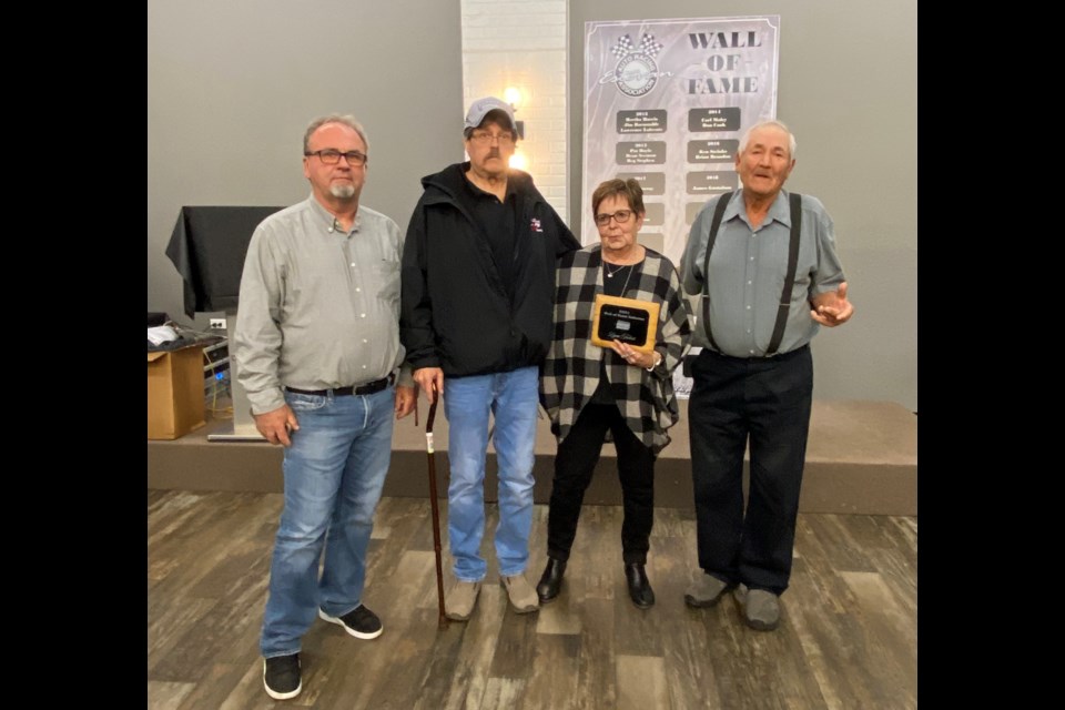 Lynn Trobert, third from right, was joined by Les McLenehan, Dennis Trobert and Norman Trobert after joining the Wall of Fame. 