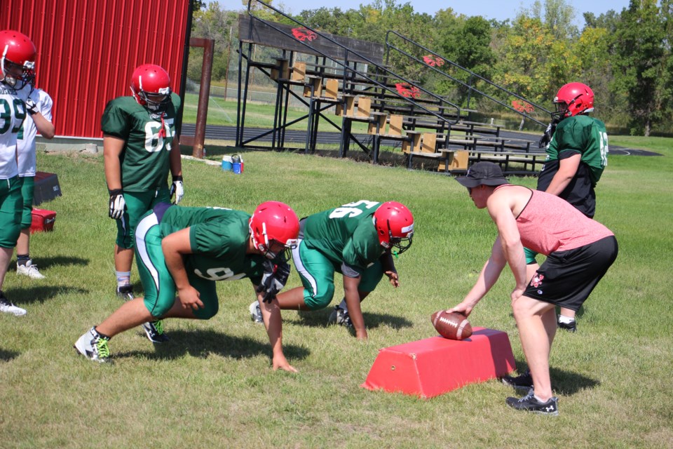 Football players for the Weyburn Comprehensive Eagles hit Darold Kot Field recently.