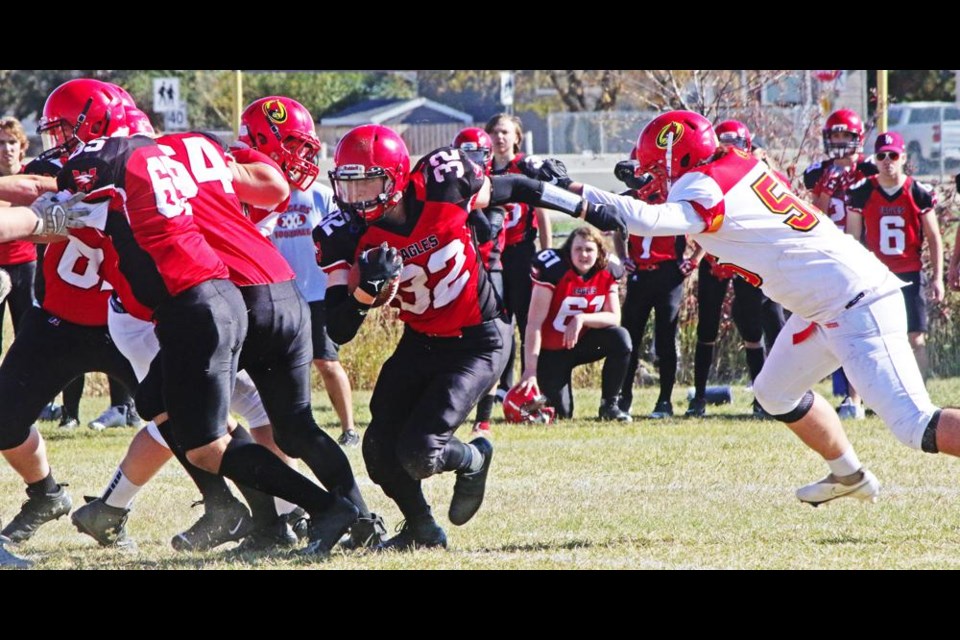 Comp Eagles running back Austin Knupp got some solid blocking in front of him to enable him to gain some yards against the Cyclones on Saturday.