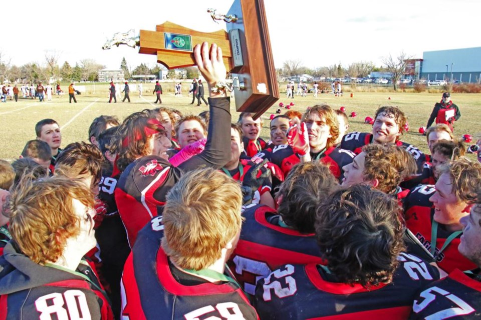 Quarterback Ben Manning raised the league trophy, surrounded by his teammates, after they beat Yorkton Raiders 21-7 on Saturday, winning the league title for the first time since 2009.