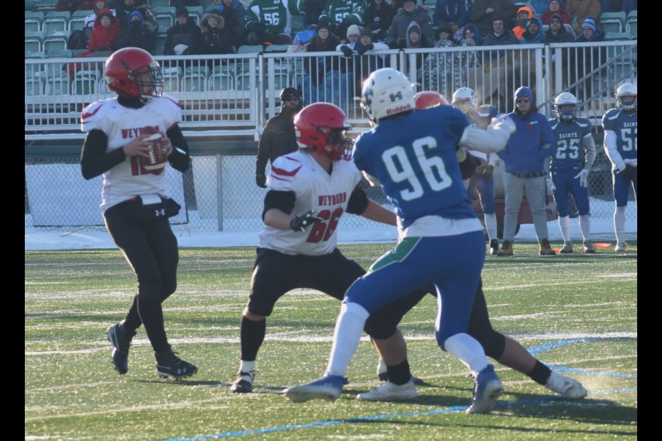 Quarterback Conner Kerr takes a look at the field, during the 5A football provincials.