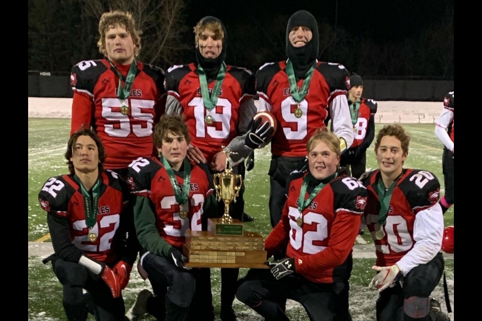 Eagles veteran players celebrate an undefeated season, after claiming the provincial title.