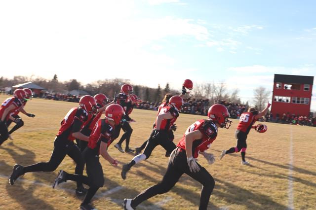 The Weyburn Comp Eagles run onto the field to celebrate advancing to the 5A provincials