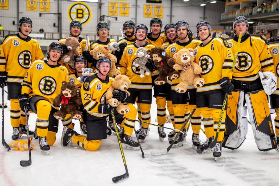 Estevan Bruins players with bears tossed on the ice after Evan Forrest's goal.