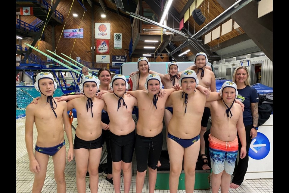 Members of the atom boys are, back row, from left, coach Melissa Enns, Sawyer Bomberak, Royce Milford, Carter Smelt and Lucinda Milford. Front row, Carter Yunick, Sebastian Martens, Samuel Boal, Hudson Enns, Dalton Maley and Langston Sherling.