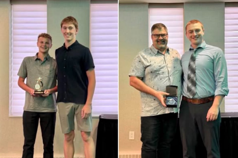 Hudson Enns, left, and Chad Knoll hold their respective awards. 
