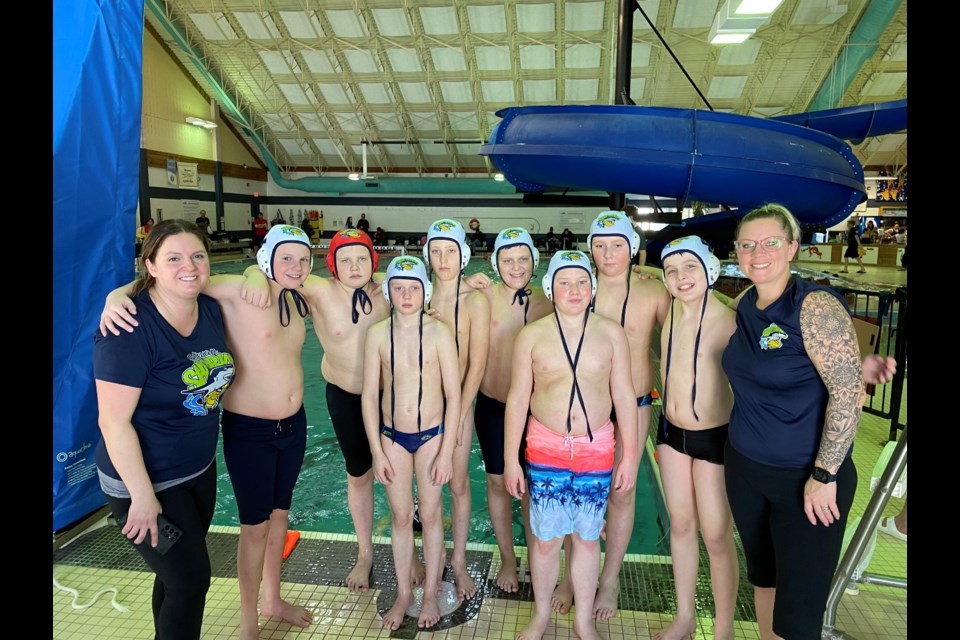 Members of the atom boys’ team were, back row, from left, coach Mellissa Enns, Hudson Enns, Carter Smelt, Carter Yunick, Sawyer Bomberak, Dalton Maley, Sebastian Martens and coach Lucinda Milford. Front row, Royce Milford and Langston Sherling.