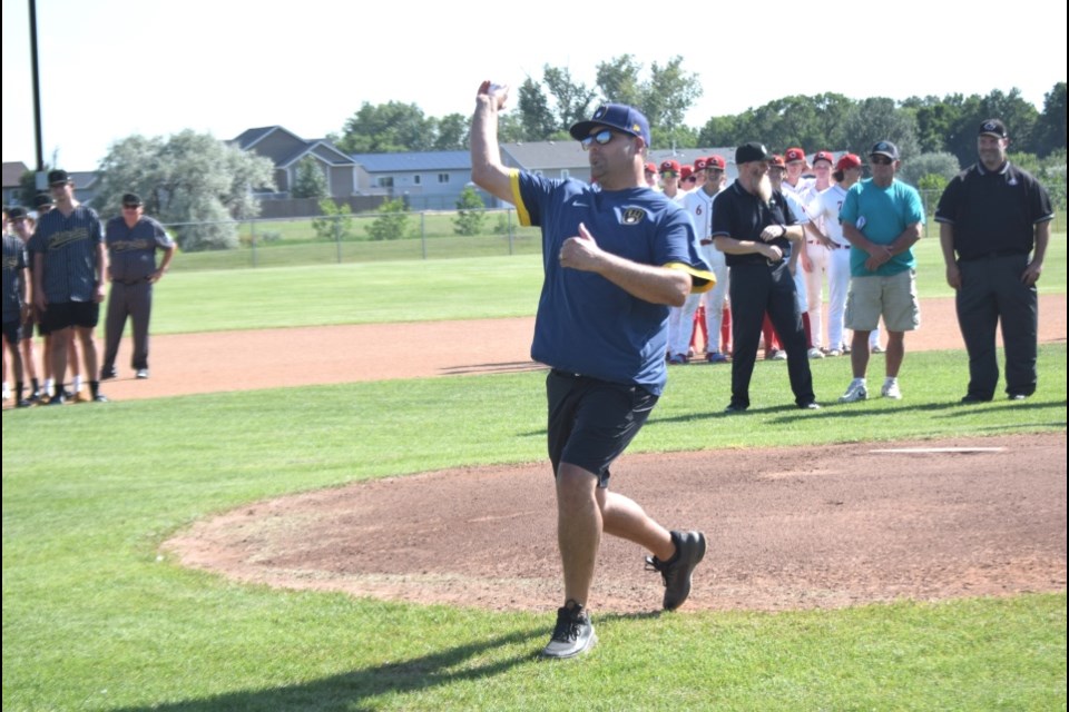 Dave Lozinski tossed the ceremonial opening pitch. 