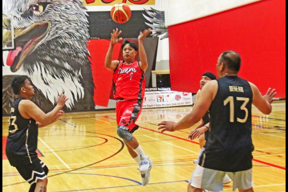 A Weyburn player (in red) laid up for two points, during their game vs Regina on Saturday morning.
