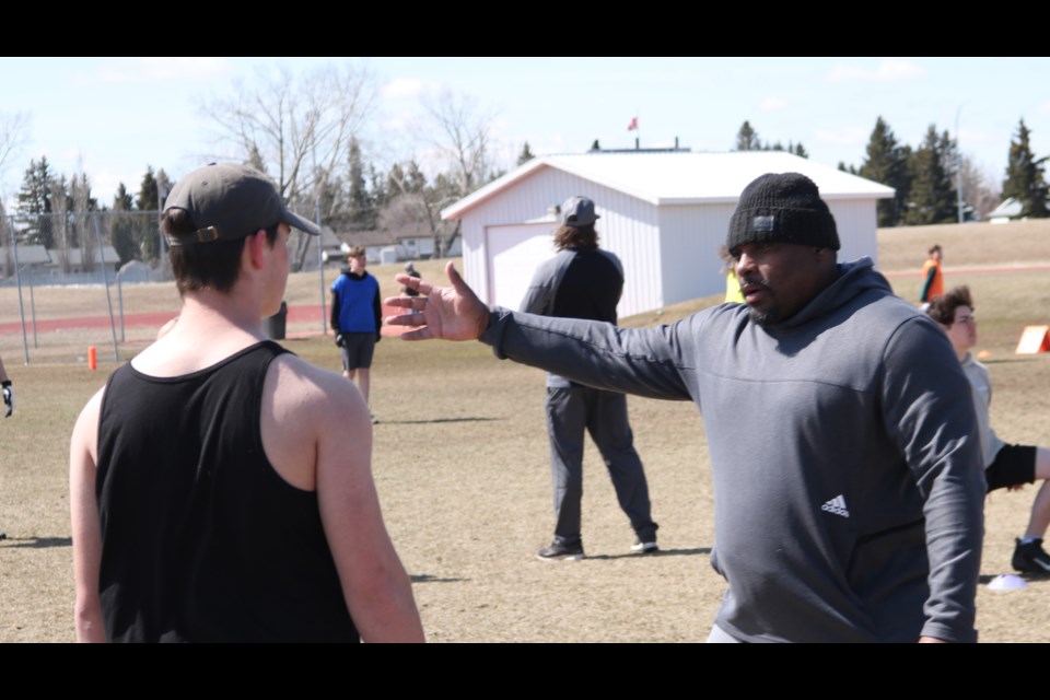 Nik Lewis a member of the Canadian Football Hall of Fame gives pointers at a football camp in Yorkton Sunday.