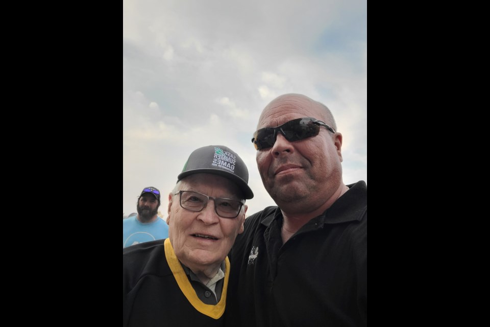 Frank John, pictured on the left with Estevan Strippers hockey club member Tony Sernick, had his number retired by the team on Saturday. 