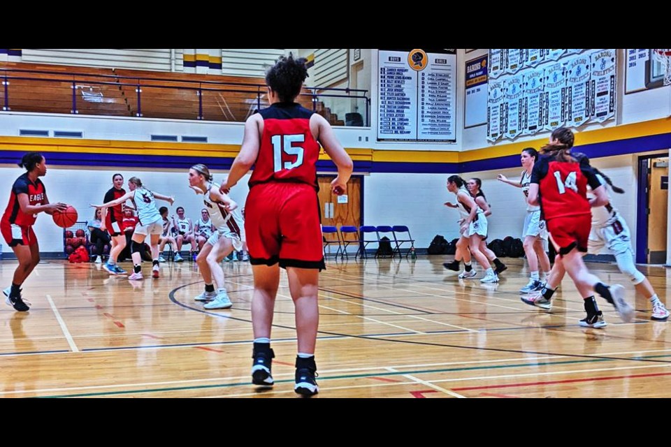 WCS Eagles player Faith Magawa, left, looked for a teammate to pass to, during their playoff game vs PA Carlton on Friday evening.