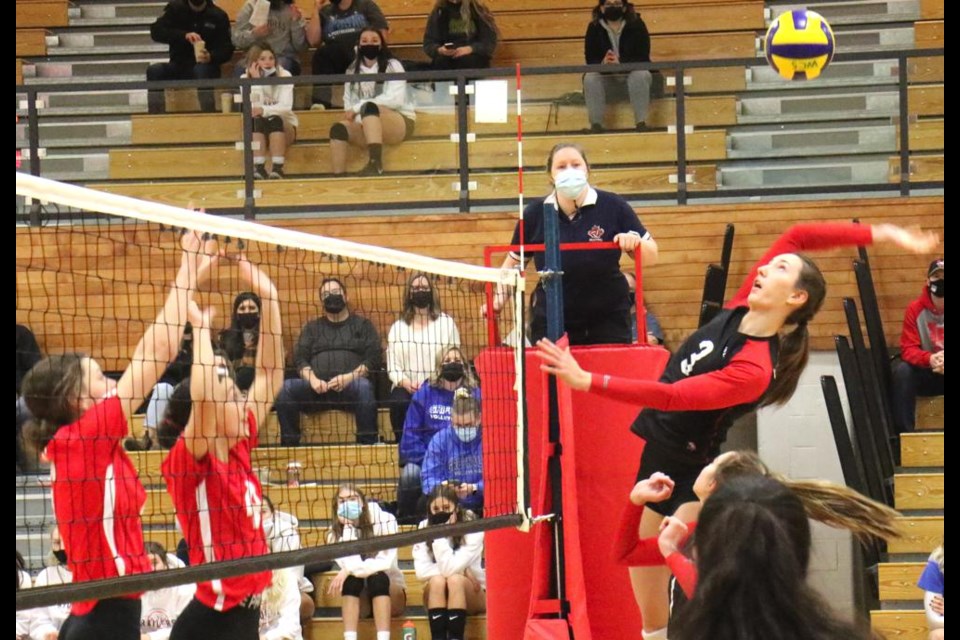 WCS Eagles player Jamie Labbie reached back to spike this ball over the net to the Estevan Elecs Saturday.