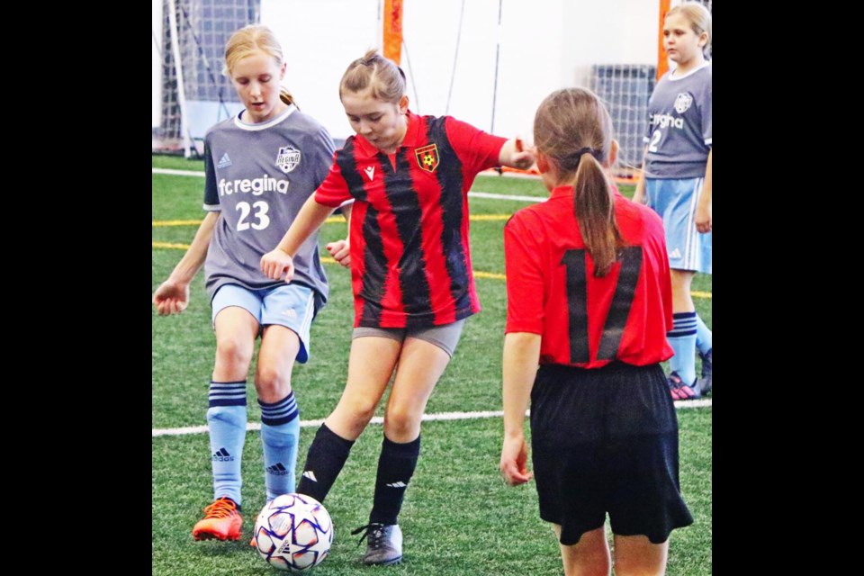 A Weyburn U11 player passed the ball up to a teammate, during an exhibition game vs FC Regina on Sunday.