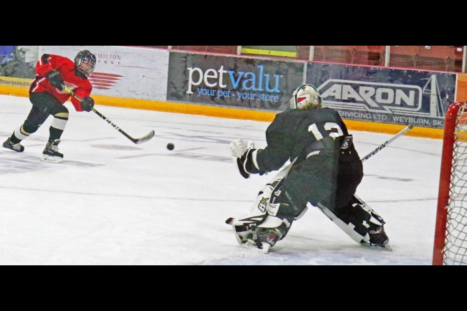 A player shoots from the top of the circle during a three-on-three ID camp hosted by the Weyburn Gold Wings midget AAA team.