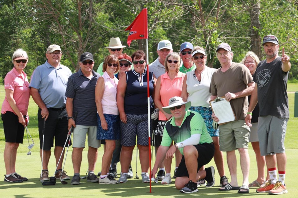 Tim Lequyer and the large contingent of witnesses of his hole-in-one. 