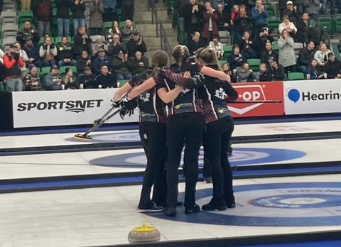 Team Homan celebrates their victory in the Grand Slam of curling championship final Dec. 17.