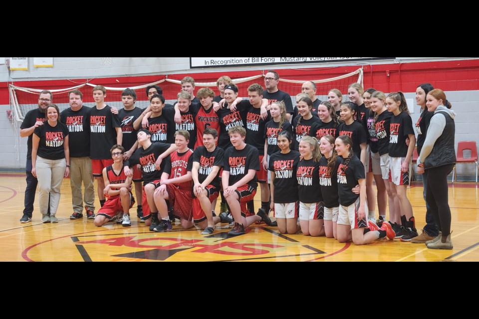 The boys team (from top row to bottom, left to right) included  Lewis Thomas, assistant coach; Mike Topola, assistant coach; Radu Bumbac, Riley Chant, Redze Geverola, Hayden Mansuy, Mason Rasmussen, Joel Rasmussen, head coach; Lauren O’Byrne, manager and organizer of Hoops for Hope; Sam Yap, Josiah McDonald, Armand Staniszewski, Ruari Liagridonis, Quinton Fettes, Konnor de Ronde, Jorge Sierra, Ethan Johnson, Grayson Ciocia, and Merit Moneo. The girls team (from top row to bottom, left to right) include Al Wandler, head coach; Jessica Beaubien, Jenna Gronsdahl, Jayda Sierra, Jayla Huys, Ella Kwasnicki, Kaitlin Oancia, assistant coach; Jessie Rood, assistant coach; Faith Kwasnicki, Jada Nesvold, Michaela Bumbac, Keanna Gee, Kian Tolentino, Diya Virani, Sam Engstrom, Shaina Gee, and Kayley Beaubien.