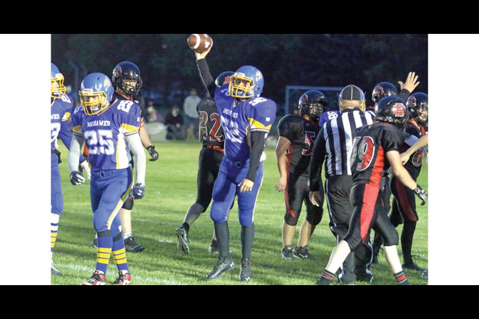 Ty Cardinal celebrates after a successful interception at the home night game against Delisle on Sept. 17.