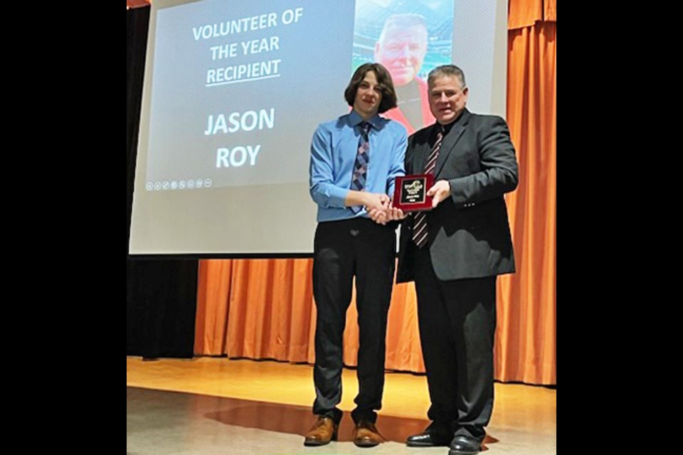 Brennen Roy congratulated his dad, Jason, on being named the Volunteer of the Year for the Saskatchewan Soccer Association, at their awards banquet held in Weyburn on Saturday evening.