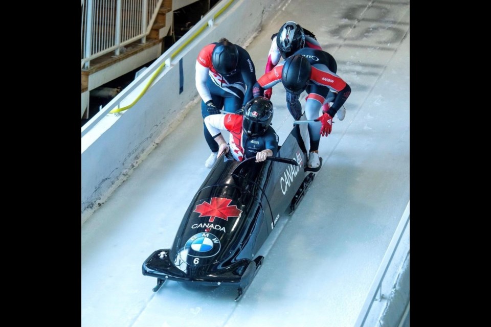 Kayden Johnson, right, participating with Team Canada in North America Cup bobsled events.