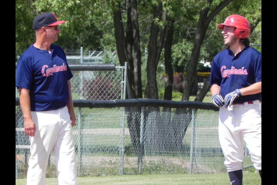 Unity Junior Cardinals enjoy the wit and wisdom of coach Dan Feser in this picture with player, Robert Duhaime.                  