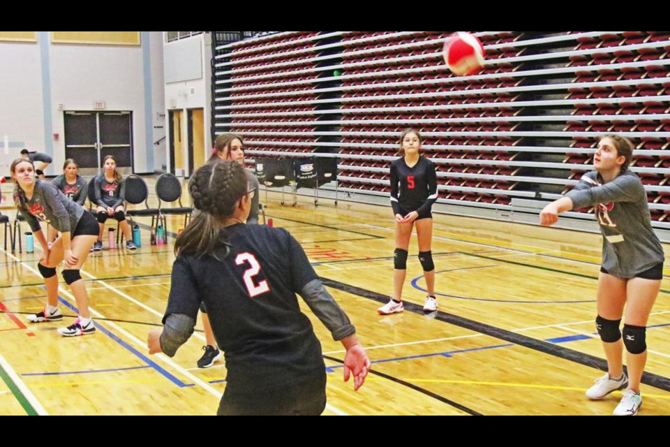 WCS Eagles player Keira Mahnke bumped up the ball off a serve by St. Michael on Friday.