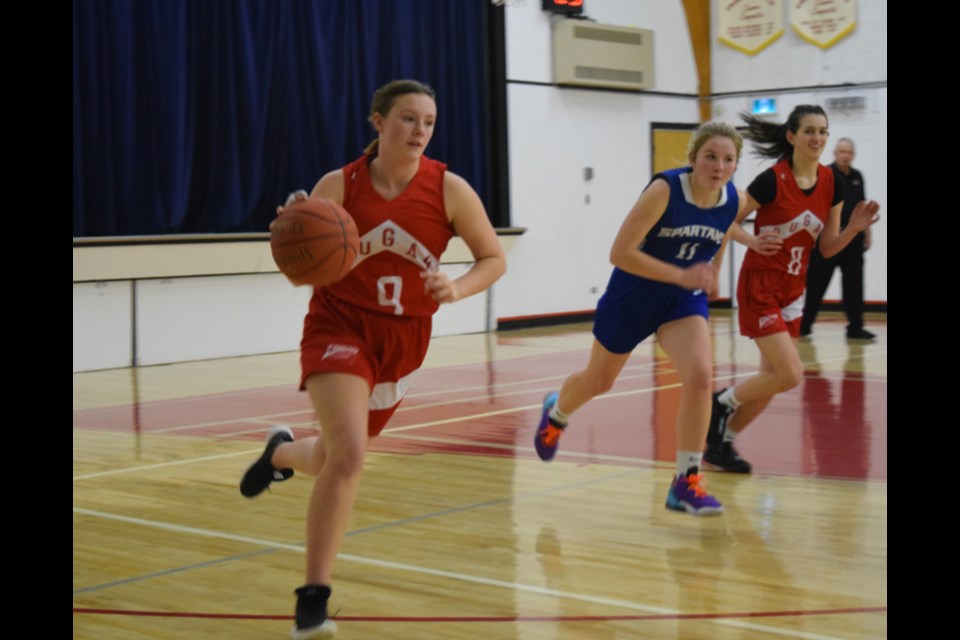 Joined by teammate Falyn Ostafie, No. 8, Miah Ruf pushed the ball up the court toward to create some offense against Kamsack on Feb. 2.