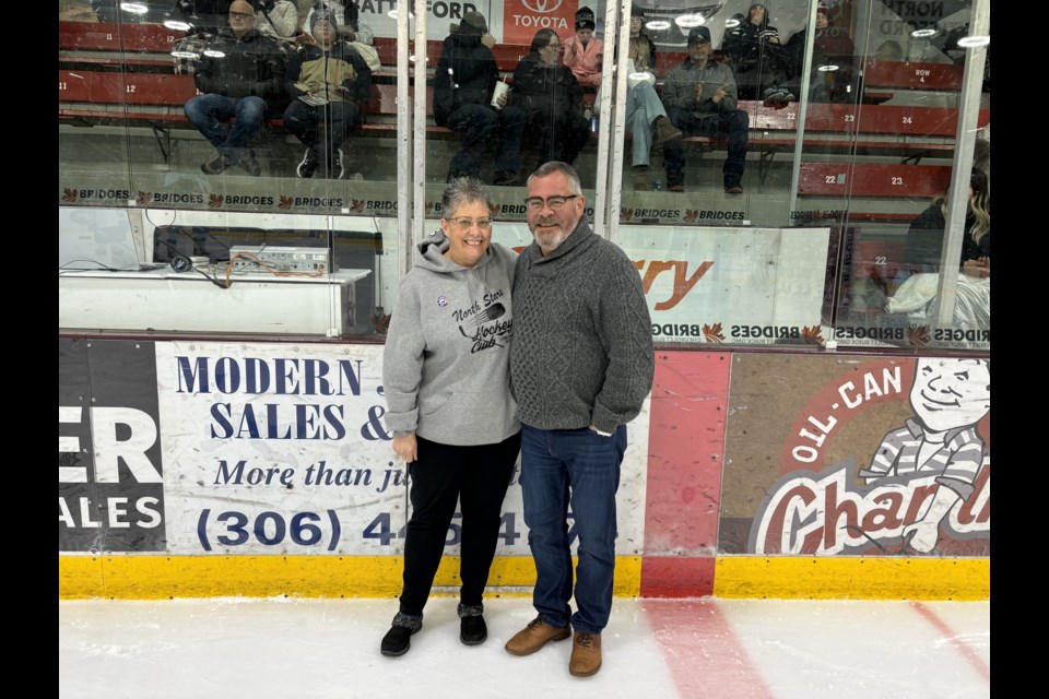Stars Executive member Kara Rosen, congratulates Tracy Cook on his upcoming induction to the SJHL Hall of Fame, being held in the Battlefords.