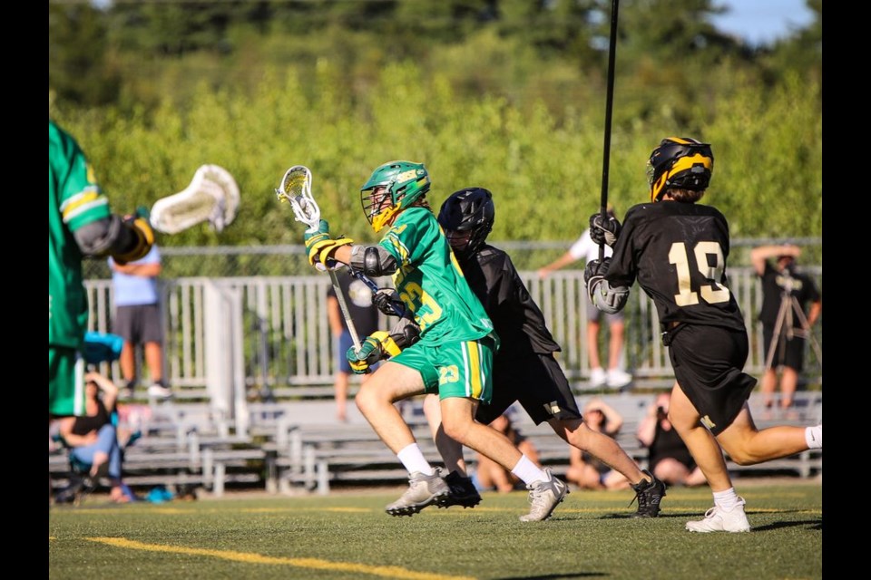 Toby Olynyk of Buchanan, a member of bronze medal-winning Team Saskatchewan, 
won the ground ball battle against a Manitoba opponent.