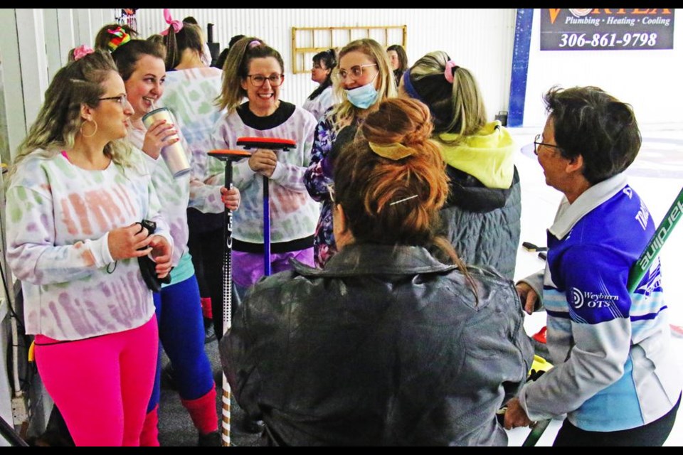 Team members were in 80s style clothing as they gathered prior to the evening draw on Friday for the Ladies Bonspiel at the Weyburn Curling Rink