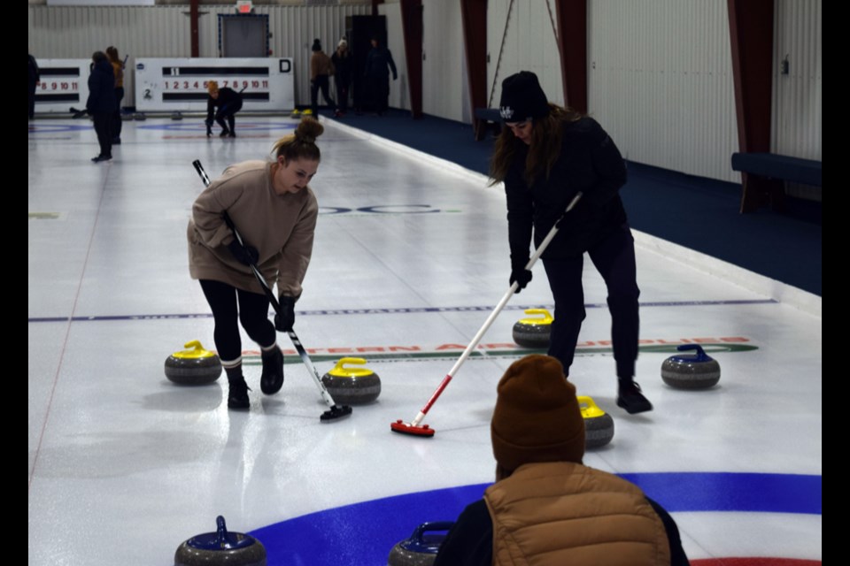 The Ally Rock foursome relied on teamwork for their success during the Canora Ladies Bonspiel. Here Rock called the line, while Kylee Toffan, left, and Jessica Kwas swept a shot by Jodie Kowalyshyn.

