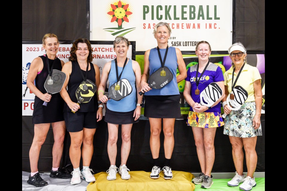 Weyburn's Deana Mainil, centre, with partner Zsuzsa Papp, won the gold medals in women's doubles at the provincial pickleball championships in Warman.