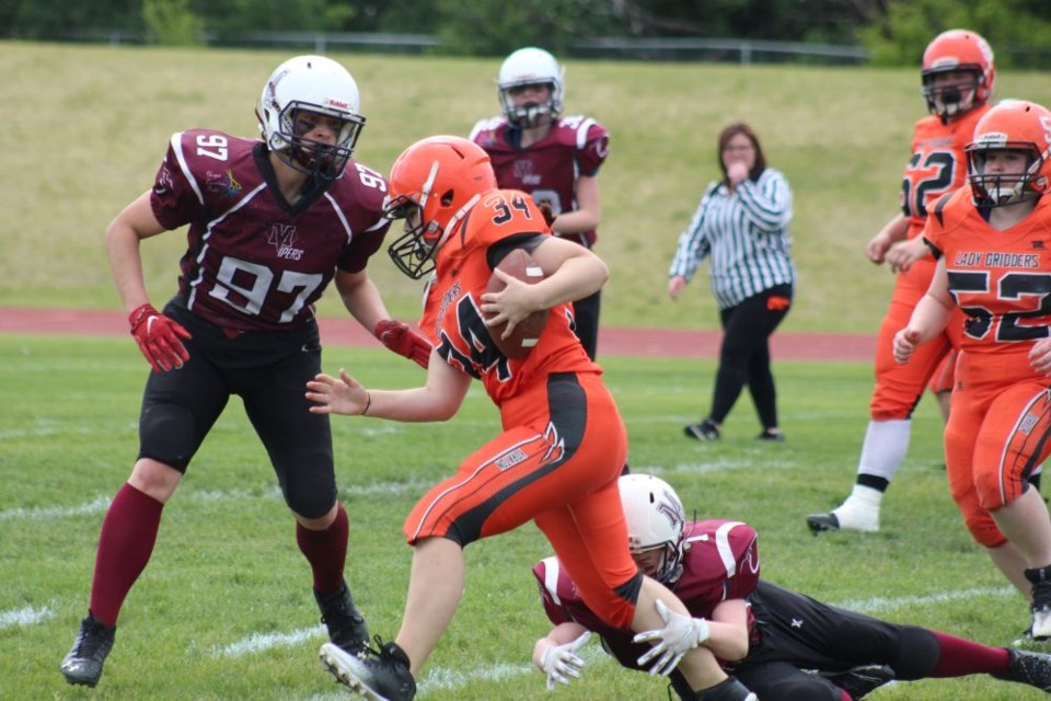 Under sunny skies at Kinsmen Century Field on June 14, the Lady Gridders delivered a dominant performance against the visiting Melville Vipers, securing an impressive 46-24 victory.
