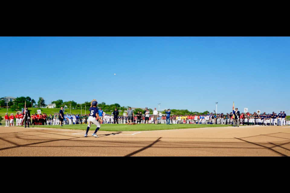 Lindsay Clark was recognized during the ceremonies on Friday and made the first pitch to open the provincial minor ball tournaments in Estevan.                               