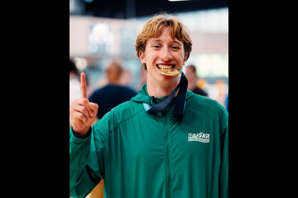 Recent McLurg graduate, Isaiah Mamer, celebrates a gold medal won by Team Saskatchewan volleyball at Canada Games.