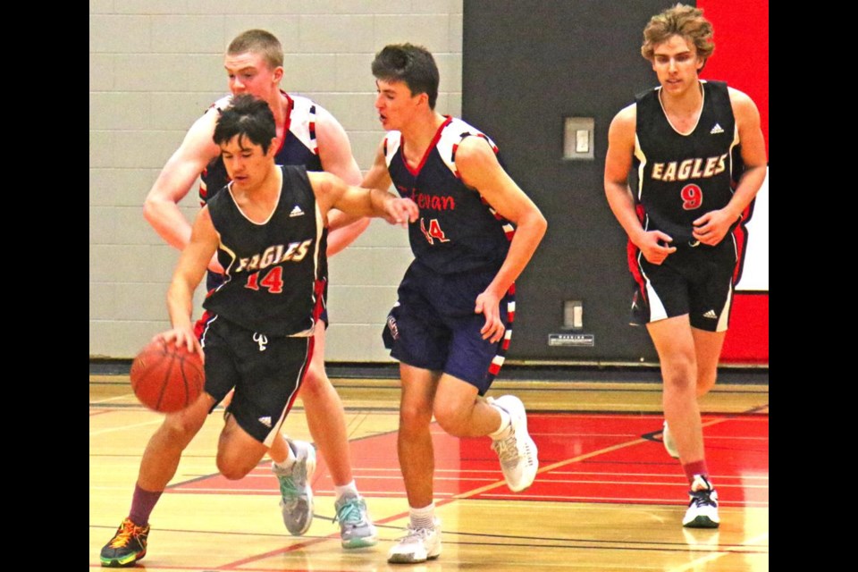 Comp Eagles player Tensei Iida broke out with the ball from Estevan's end during the Mcleod Series