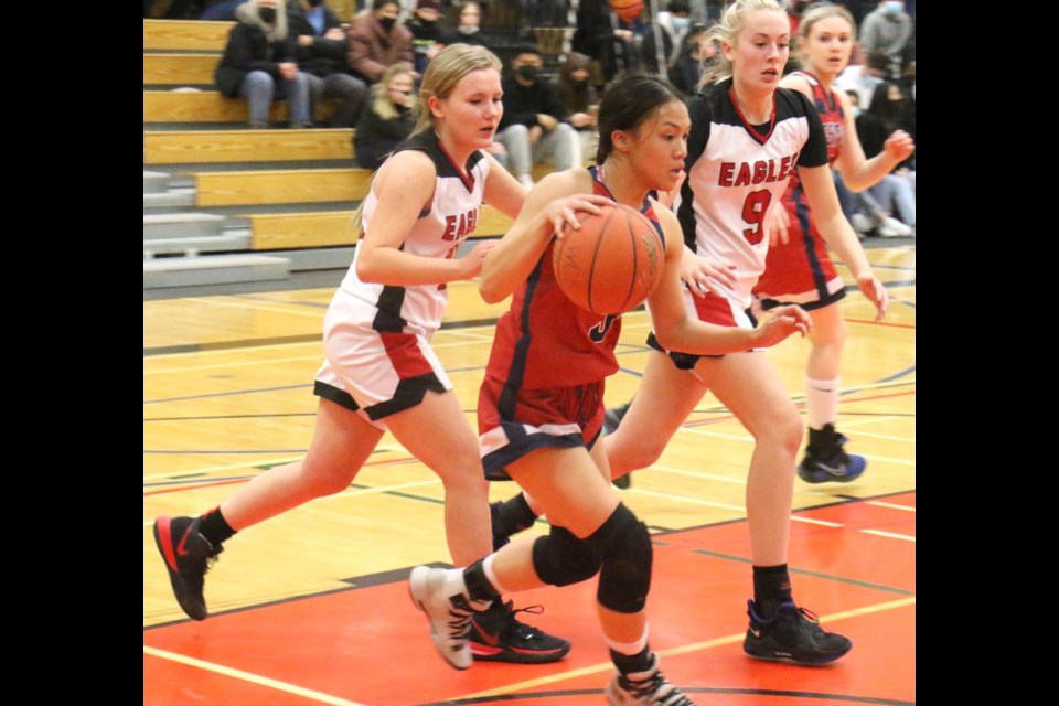 Frances Aceron steals the ball in Weyburn’s end during Monday's game. 

