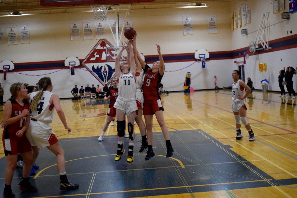 Gabbie Simon and other members of the Estevan and Weyburn senior girls teams jump for the ball during the senior girls game. 