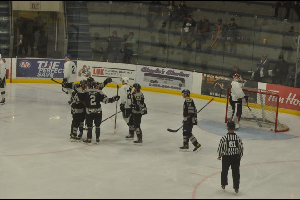 The North Stars celebrate Ryland McNinch's game tying goal in the third period.