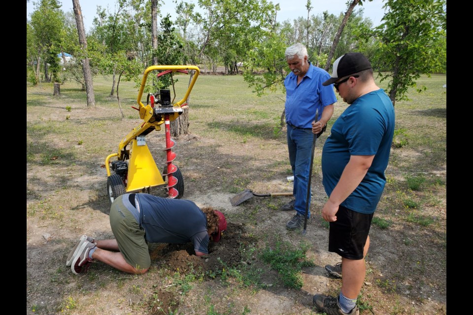 Melville installs Innova disc baskets at local course Thursday, July 29.